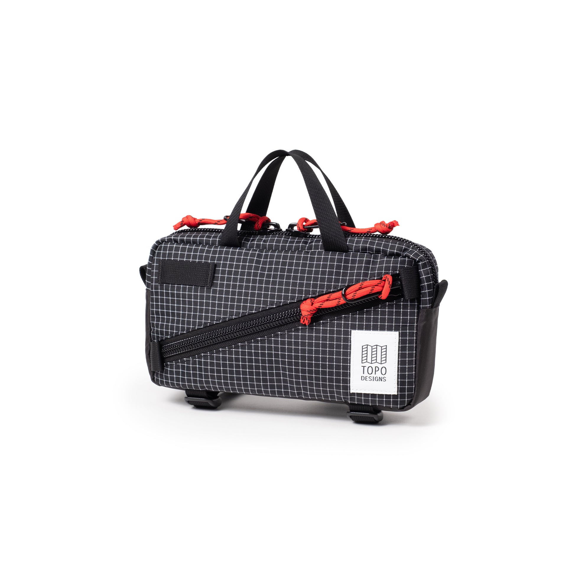 Quarter View of Topo Designs Mini Quick Pack in "Black Grid"